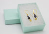 Iolite gold drop earrings with star detail by Luminous Moon
