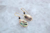 Iolite and gold edged shell drop earrings by Luminous Moon