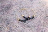 Ebony Tide Black Spinel gold hoop earrings by Luminous Moon