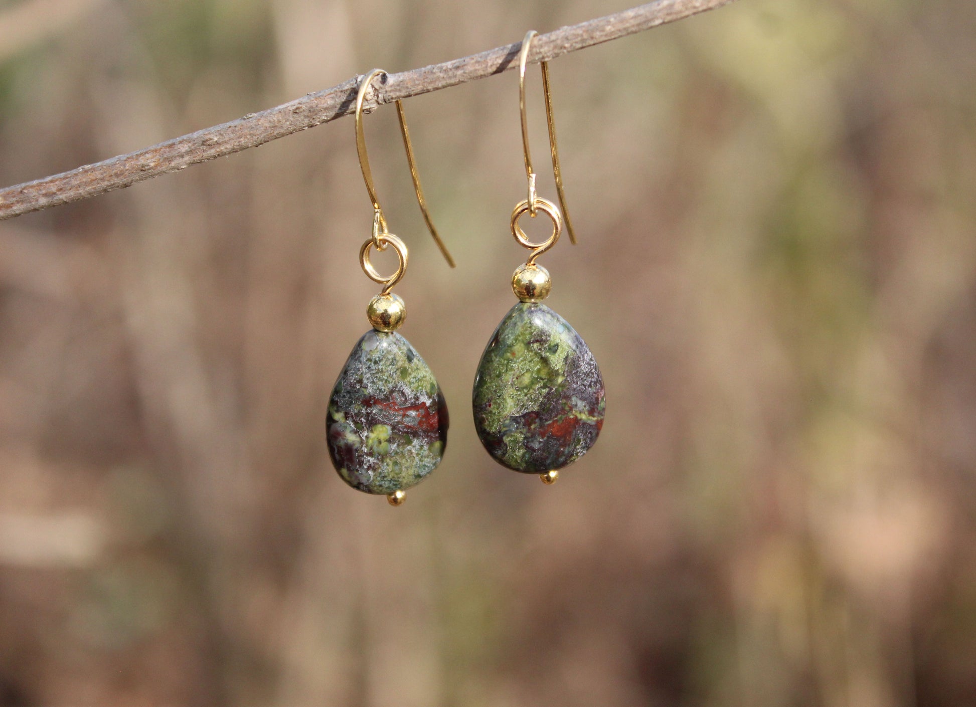 Dragon’s Blood Jasper teardrop earrings featuring natural green and red jasper stones on 14k gold-plated hooks